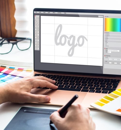Graphic design desktop with  laptop and tools